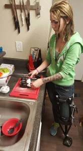 Below knee amputee Aline cooking on iWALK Hands-Free Crutch