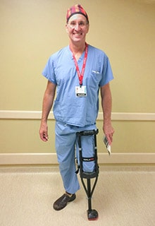 Dr. Thomas Florack standing on an iWALK at work - iWALKFree