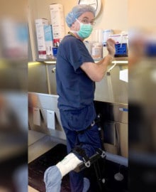 Dr. William Jernigan using an iWALK crutch while working at a clinic - iWALKFree
