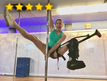 Woman wearing iWALK Hands-Free Crutch on dancing pole