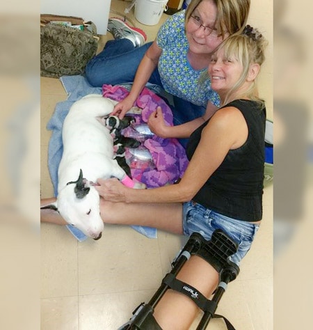 Woman wearing iWALK Hands-Free Crutch with dog