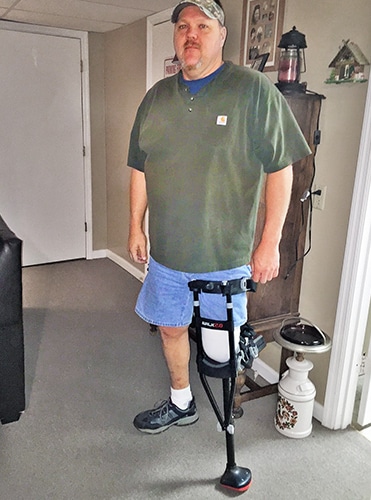 Below knee amputee wearing iWALK Hands-Free Crutch