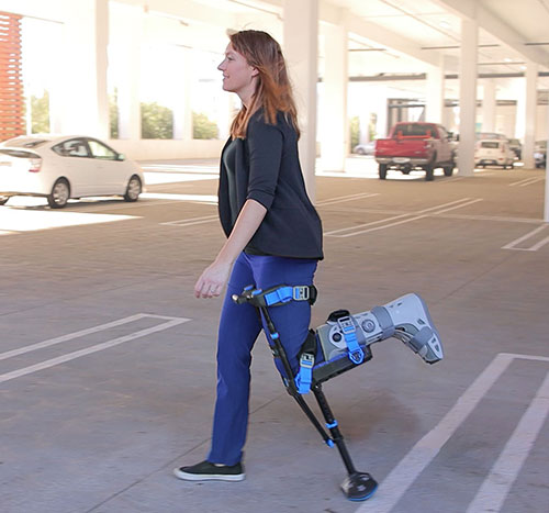 Image of a woman walking with an iWALK hands-free crutch
